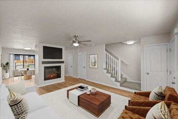 A living room with a fireplace and a television.